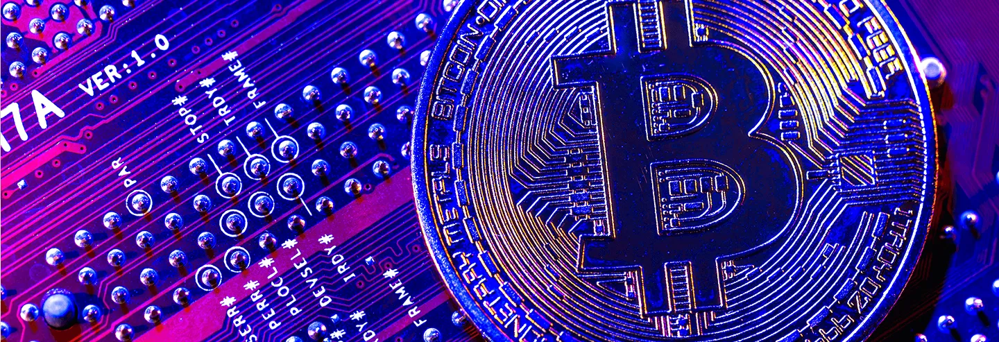 Bitcoin coin on an electronic board